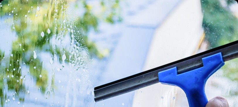 Window cleaning with squeegee